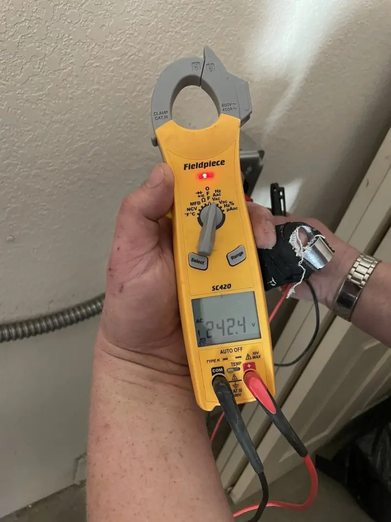Voltage testing with clamp meter during Electrical Installation Services in Hansville